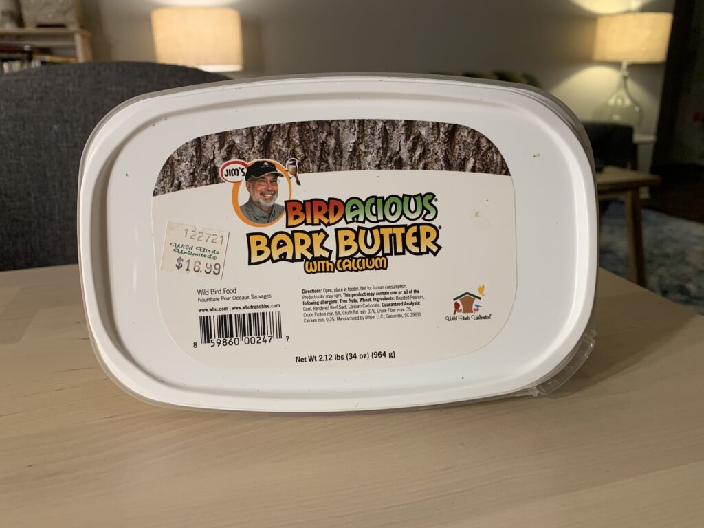 A Container of Bark Butter Suet sitting on a kitchen table. 