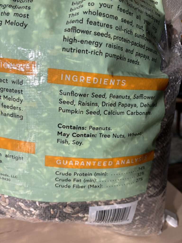 The back of a bag of Melody Select bird seed showing its ingredients.